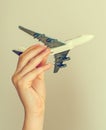 Child hand holding model airplane. Royalty Free Stock Photo