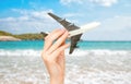 Child hand holding model airplane. Royalty Free Stock Photo