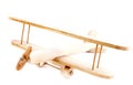 Child hand made wooden aircraft over white