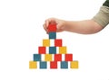 Child hand make a building of blocks Royalty Free Stock Photo
