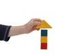 Child hand make a building of blocks Royalty Free Stock Photo