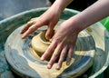 child hand makes the clay modelling