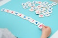 Child hand makes word QUARANTINE