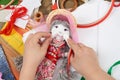 Child hand making dress for handmade doll, learn to sewing Royalty Free Stock Photo