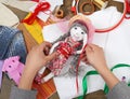 Child hand making dress for handmade doll, learn to sewing Royalty Free Stock Photo