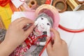 Child hand making dress for handmade doll, learn to sewing Royalty Free Stock Photo