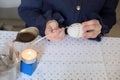 Child hand paints an Easter egg after sorbian tradition with goose feather and candle wax Royalty Free Stock Photo