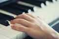 Child Hand playing Music keyboard piano Royalty Free Stock Photo