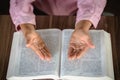 Child hand while praying for christian religion, Casual woman praying with  Holy Bible, Religion concept Royalty Free Stock Photo