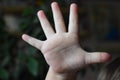 child hand is showing five fingers Royalty Free Stock Photo