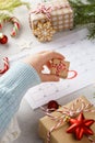 Child hand taking Christmas gift box from planner page Royalty Free Stock Photo