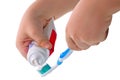 Child hand and toothpaste Royalty Free Stock Photo