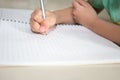 Child hand writing on blank notebook pencil and copy space in v Royalty Free Stock Photo