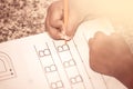 Child hand writing her homework with crayon Royalty Free Stock Photo