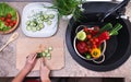 Child hands chopping vegetables on cutting board - slicing the c