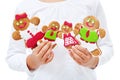 Child hands with happy gingerbread people family