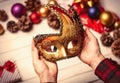 Child hands holding a carnival mask Royalty Free Stock Photo