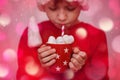 Child hands holding red cup of hot cocoa or chocolate with marshmallow. Christmas concept Royalty Free Stock Photo