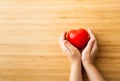 Child hands holding red heart, health care, donate and family insurance concept Royalty Free Stock Photo