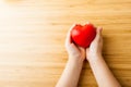 Child hands holding red heart, health care, donate and family insurance concept Royalty Free Stock Photo