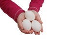 Child hands holding a three eggs