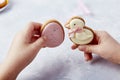 Child hands holds Easter cookies. Tasty Easter traditions. Festive Easter flavors. Happy Easter background.