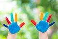 Child hands painted in colorful paints ready for hand prints Royalty Free Stock Photo