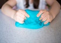 Child hands playing with colorful clay. Homemade plastiline. Royalty Free Stock Photo