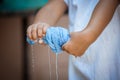 Child hands squeeze wet blue towel p