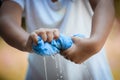 Child hands squeeze wet blue towelp Royalty Free Stock Photo