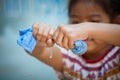 Child hands squeeze wet blue towelp Royalty Free Stock Photo