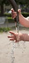 Child hands in water fountain Royalty Free Stock Photo