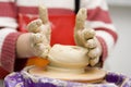 Child hands working on potter wheel Royalty Free Stock Photo