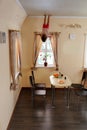 Child hanging up side down in kitchen Royalty Free Stock Photo