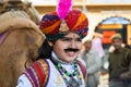 Child with happy face shows the beautiful indian costume