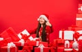 Child happy girl find gifts christmas tree. Merry christmas. Happy childhood concept. Happiness and joy. Kid santa hat