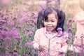 Child happy little girl running and having fun in flower field Royalty Free Stock Photo