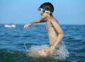 Child has fun with the mask in the sea Royalty Free Stock Photo