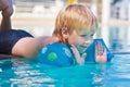 Child has fun in the swimming-pool Royalty Free Stock Photo