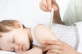 Child has a high temperature or fever, using a thermometer Royalty Free Stock Photo