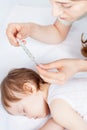 Child has a high temperature or fever, using a thermometer Royalty Free Stock Photo