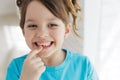 The child has lost a tooth. Little girl without a tooth. The first tooth fell out. Royalty Free Stock Photo