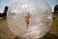 Child has a lot of fun in the Zorbing Ball Royalty Free Stock Photo