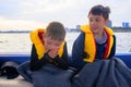 The child has seasickness on the boat. Royalty Free Stock Photo