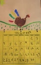 Child hand print finger paint drawing of turkey and November calendar for Thanksgiving Royalty Free Stock Photo