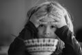 Child have a breakfast. Sad boy eating healthy chicken noodle soup for lunch. Unhappy baby child taking food at home or Royalty Free Stock Photo