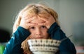 Child have a breakfast. Sad boy eating healthy chicken noodle soup for lunch. Unhappy baby child taking food at home or Royalty Free Stock Photo