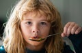 Child have a breakfast. Tasty kids breakfast. Adorable little school boy eating vegetable soup indoor. Childcare and Royalty Free Stock Photo