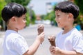 Child have enjoy for eating chocolate ice cream. Little boy eating an ice cream outdoors