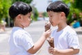 Child have enjoy for eating chocolate ice cream. Little boy eating an ice cream outdoors